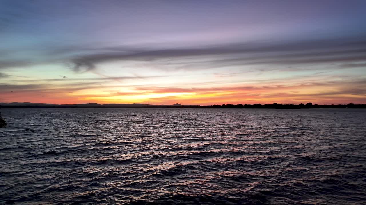 Golden sunset over Bendiwewa Lake in Polonnaruwa, Sri Lanka