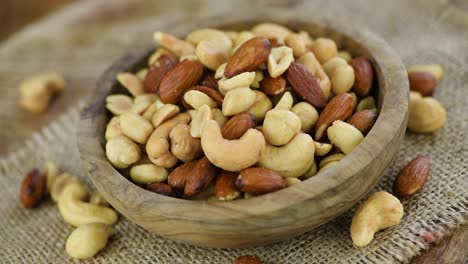 portion of roasted nuts on a rotating plate (seamless loopable)