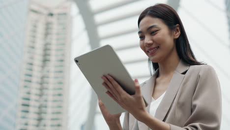 business woman using tablet in city