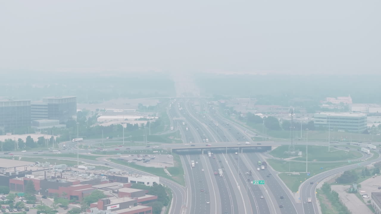 Smoke-filled cityscape with hazy visibility from wildfire smoke in Mississauga, Ontario