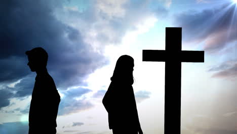 animation of silhouette of couple over clouds and cross