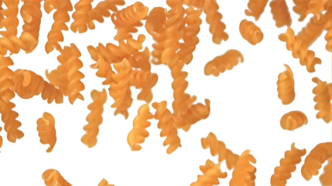 Dry Fusilli Pasta Falling in Slow Motion on White Background