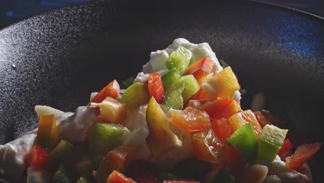 chopped fresh bell pepper with mayonnaise and cheese dressing seasoned with salt and pepper