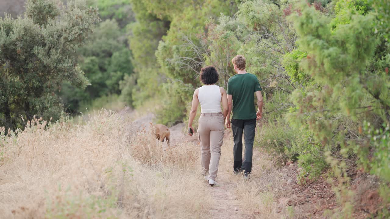 People walking outdoors with dog