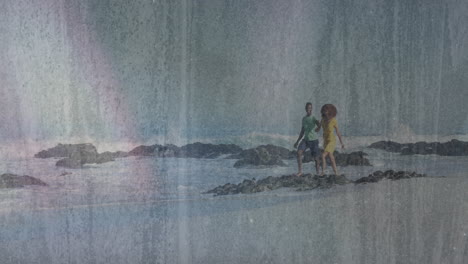 walking on rocky beach, couple enjoying animation with vintage textured overlay
