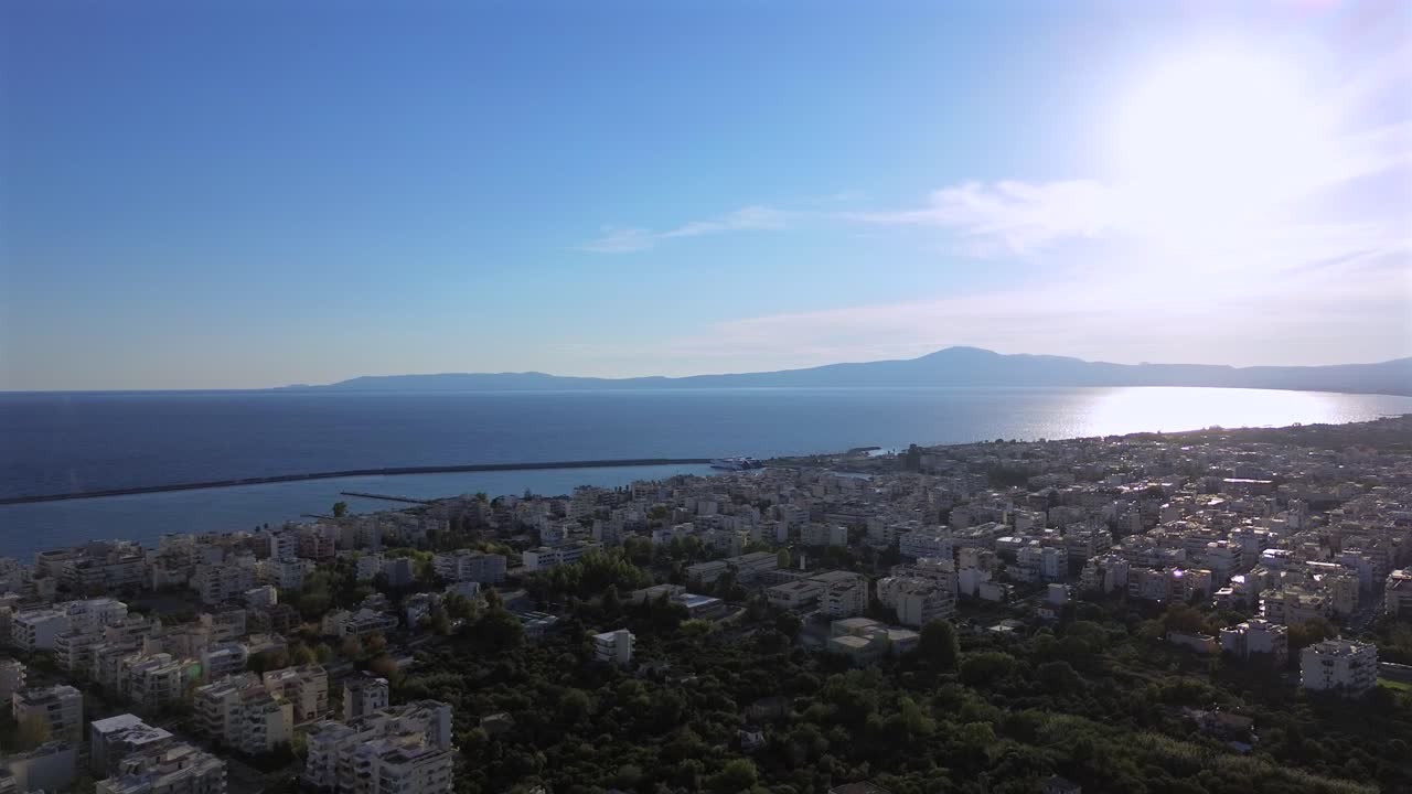 Aerial view of Messinian gulf, view from Kalamata city, Peloponnese ,Greece. Push out , left pan, high angle view 4K on a sunny autumn day