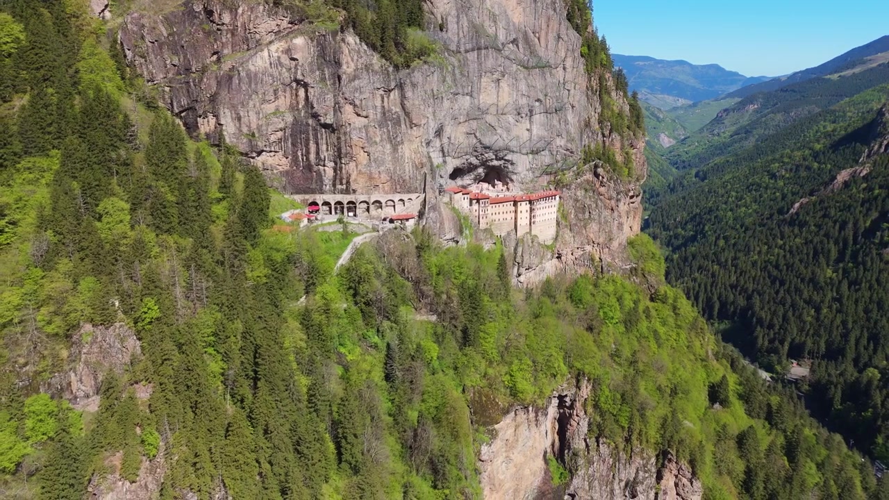 Drone Aerial Dolly Out Historic Sumela Monastery Built into a Steep Cliff Face in Trabzon Turkey