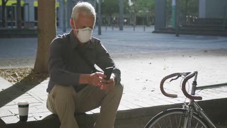 Caucasian-man-out-and-about-in-the-street-wearing-on-a-face-mask-against-coronavirus