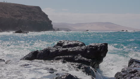 Breathtaking views of Fuerteventura with Lobos Island, Red Flag Beach, kite surfers, sunsets, volcanoes, sand dunes, and wingfoilers in the Canary Islands’ golden light.