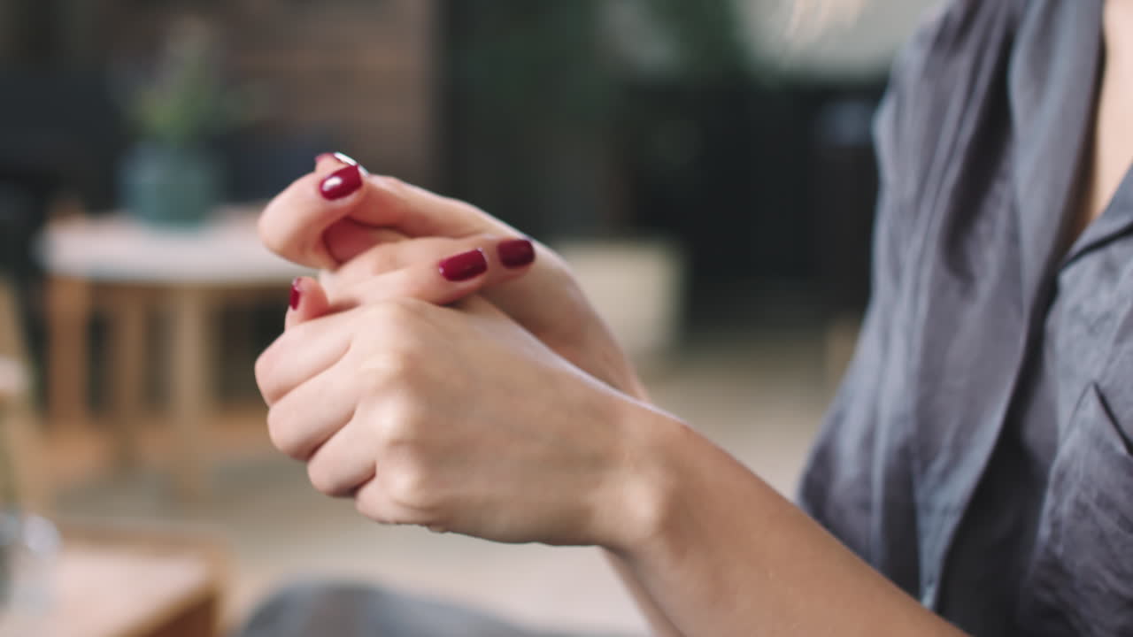 Woman Applying Cream On Hands