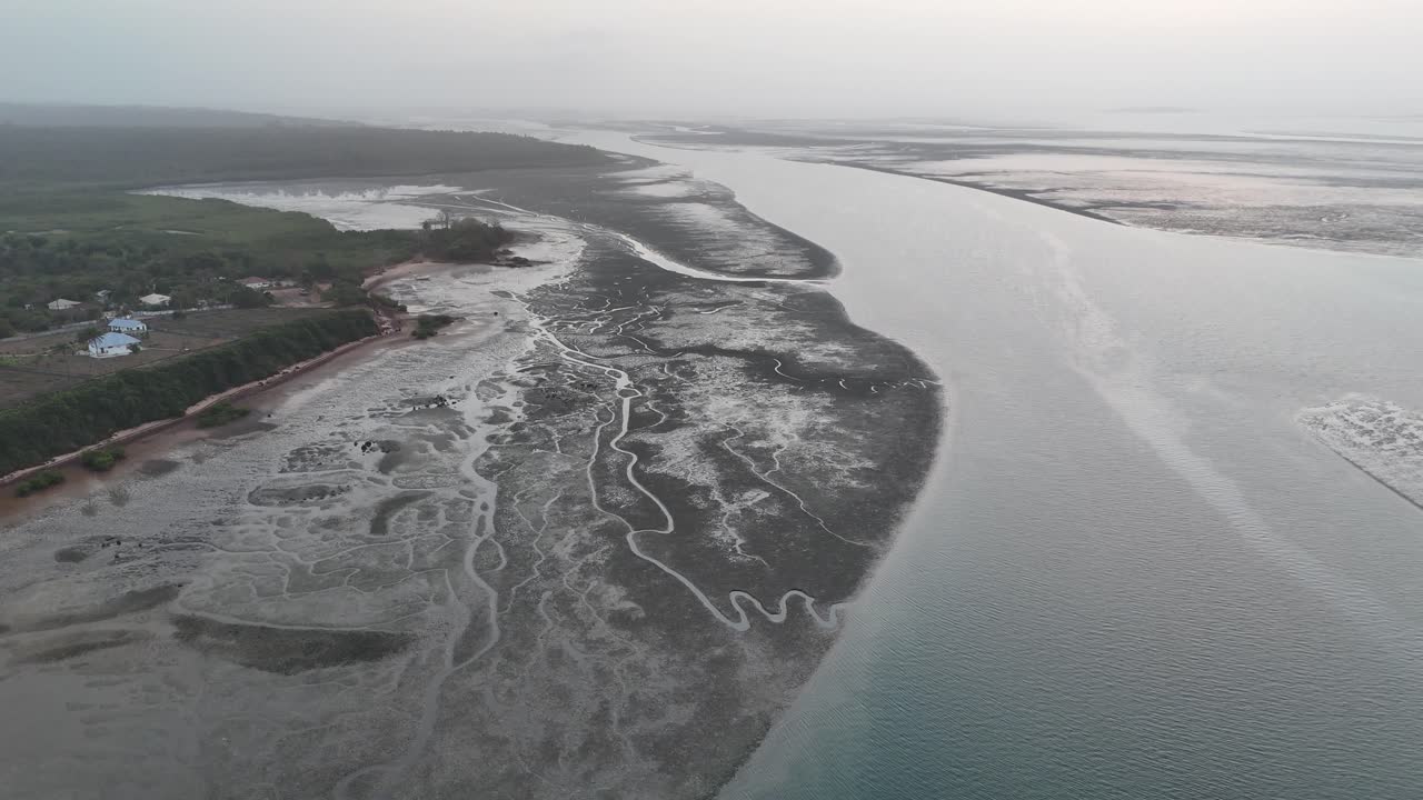 Aerial drone view of tidal channels and coastal wetlands in the Bijagos Islands, Guinea Bissau, showcasing unique patterns and untouched nature