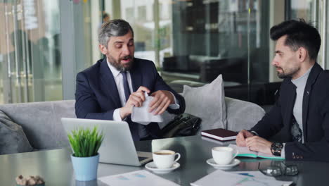 businessmen in a coffee shop meeting
