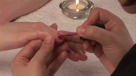 woman receiving a manicure