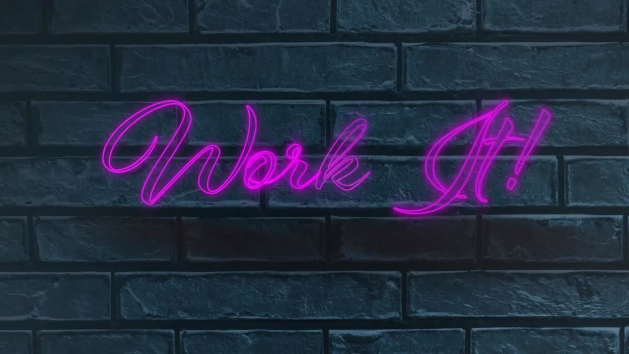 Neon purple work it text against grey brick wall in background