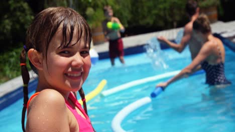 portrait of smiling girl near poolside