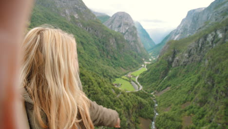 woman taking selfie in norwegian fjords