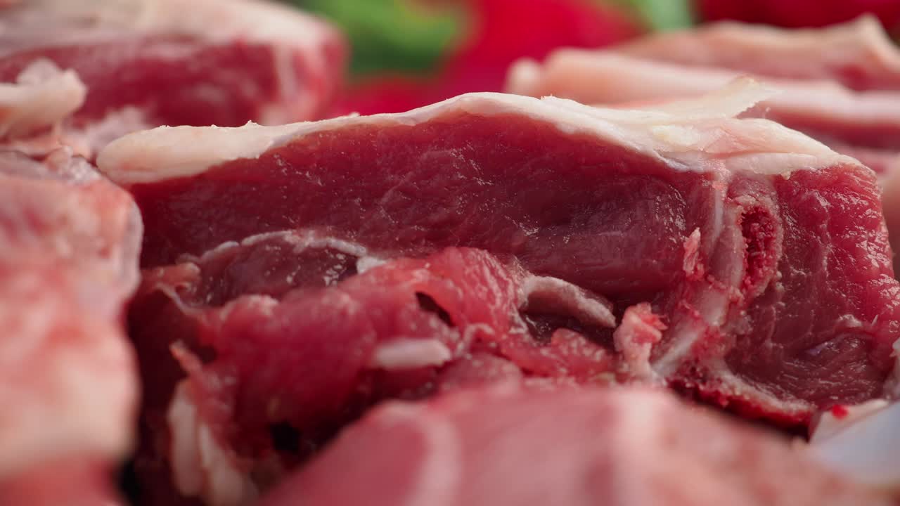 Close-up of Fresh Raw Meat Cuts with Bone and Fat
