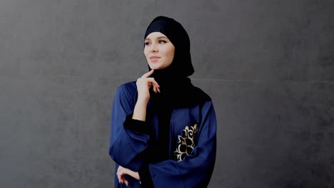 serious emirati woman thinking deeply looking far away wearing traditional uae abaya and hijab women's clothing in the middle east gulf