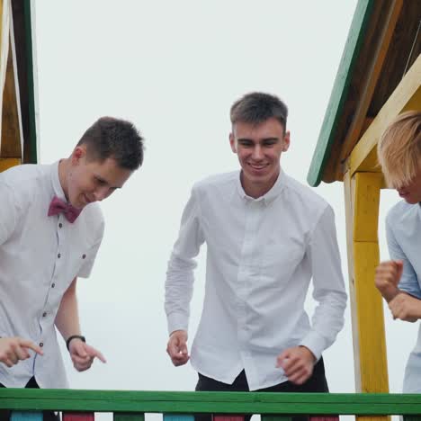 high school graduates having fun fooling around at prom