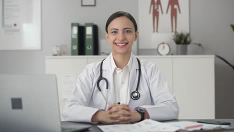 happy indian female doctor wearing stethoscope