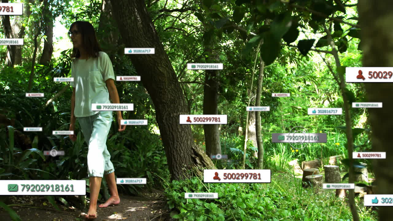 Woman walking along woodland path, interacting with floating AR tags and ID icons for technology