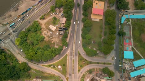 Traffic-and-cityscape-of-Victoria-Island,-Lagos,-Nigeria-featuring-Falomo-Bridge,-Lagos-Law-school-and-the-Civic-centre-tower