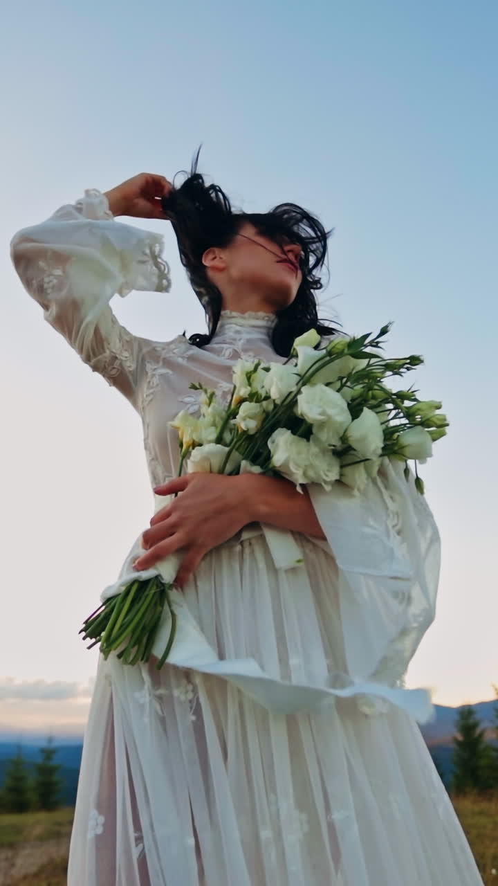 Young pretty lady walking on the nature. Beautiful woman in dress on landscapes. Vertical video