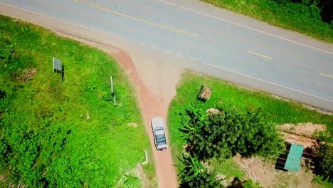 Vehicle-On-Safari-Trip-In-Uganda-At-Daytime---aerial-top-down