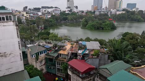 rooftop view of buildings and lake in hanoi