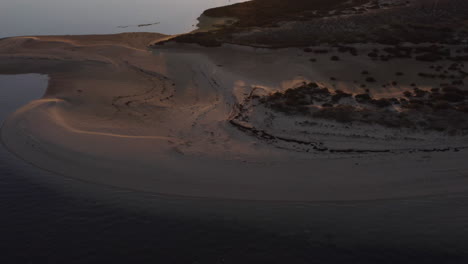 glistening ocean water and vast landscape of armona island - aerial shot