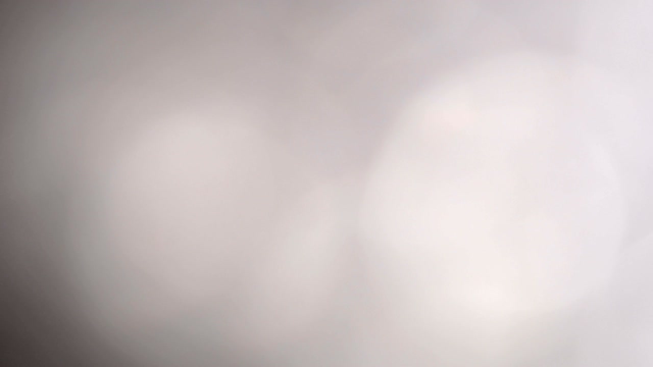 partículas de chispas abstractas que se mueven pequeñas grandes desenfocadas