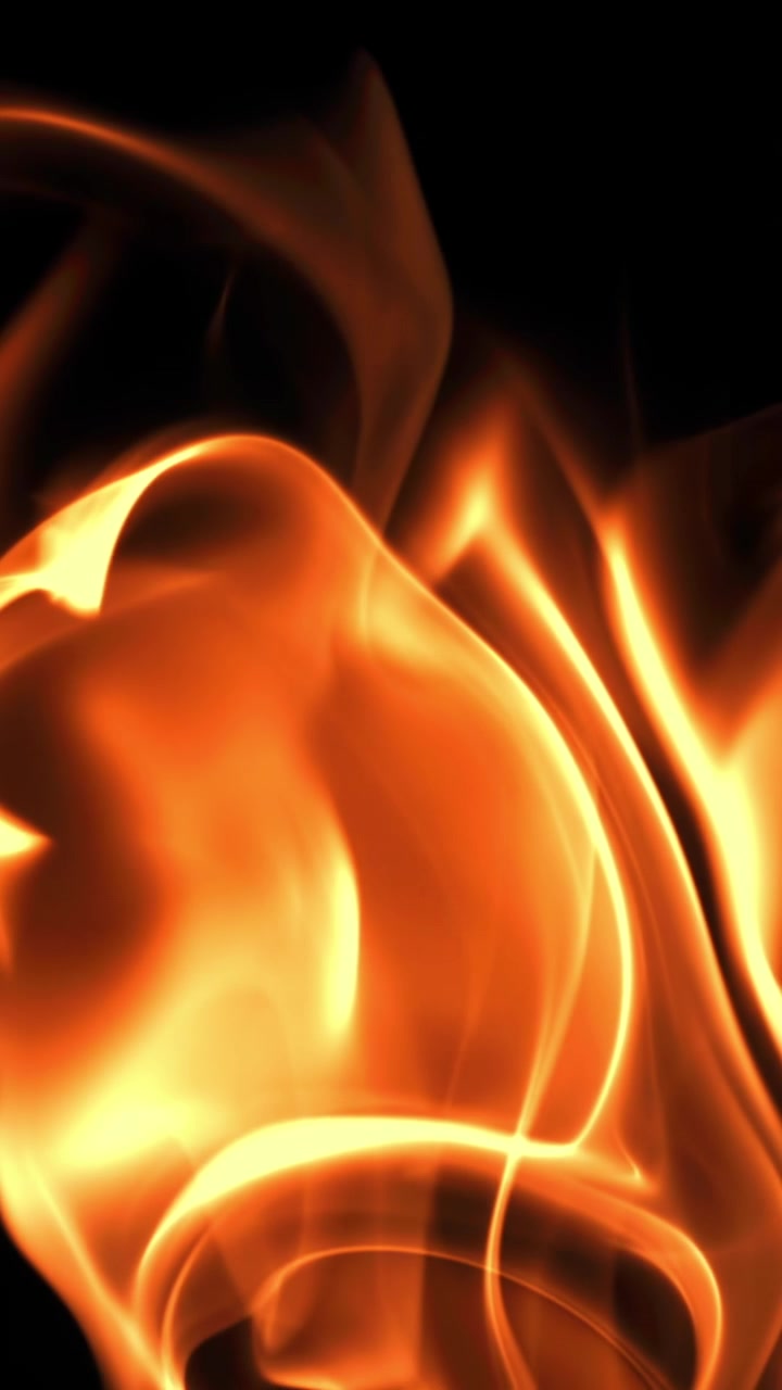 Primo piano astratto di fiamme dinamiche arancioni e gialle