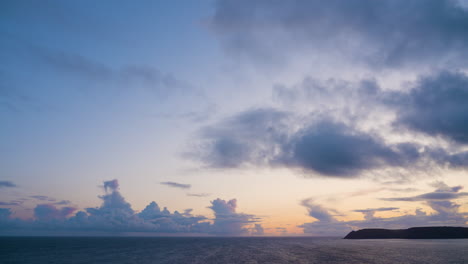 sunset over the ocean with dramatic cloudscape