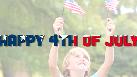 independence day text against boy holding two u.s. flags