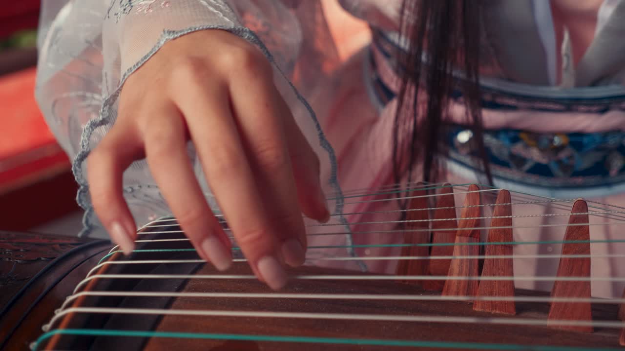 Chinese Girl Playing Guzheng Outside