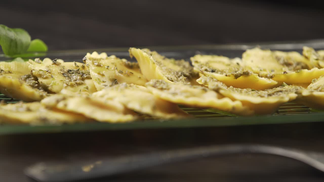 A cook finishes decorating the perfect dish for his gourmet kitchen. Concept of: food, cuisine, chef, gourmet, artist