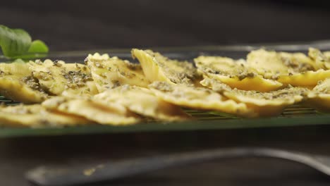 a cook finishes decorating the perfect dish for his gourmet kitchen. concept of: food, cuisine, chef, gourmet, artist