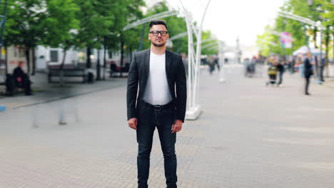 man in a black jacket on a city street