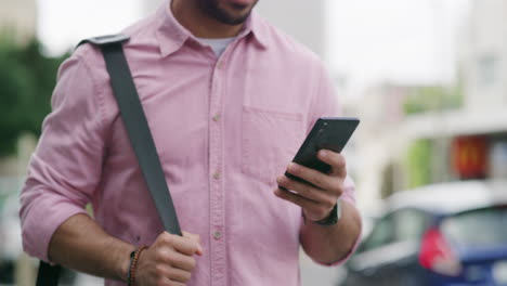 man using phone in the city