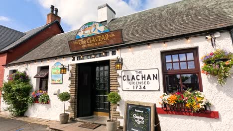 historic pub with vibrant floral displays