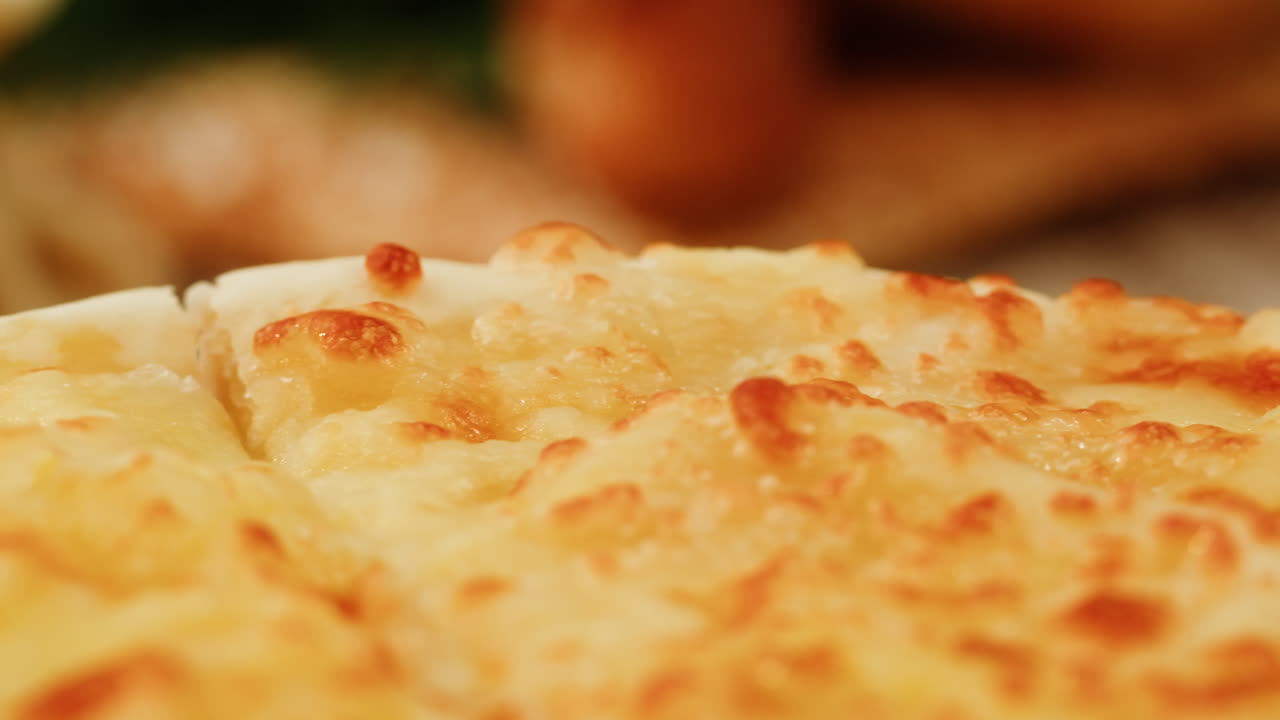 Close-up of a cheesy, baked potato dish