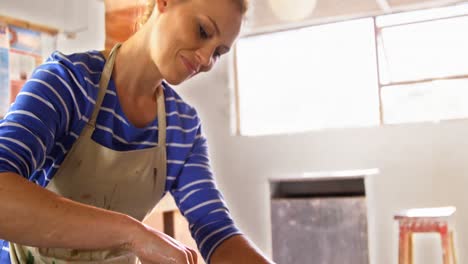 Female-potter-making-a-pot