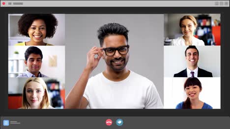 Diverse-man-group-of-business-people-having-online-business-conference-video-call-on-tv-screen-monit.Diverse-male-group-of-business-people-having-online-business-conference-video-call-on-tv-screen-monitor-in-board-meeting-room.-Slow-motion