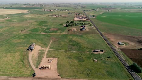 Birdseye-perspective-on-an-early-morning-during-the-beginning-of-summer-over-ranch-properties-in-northern-Colorado