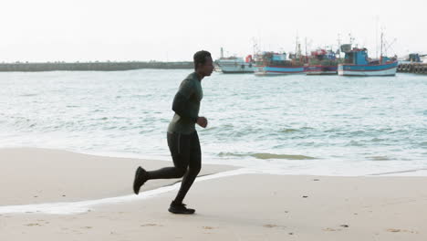 running, fitness and man on beach for exercise