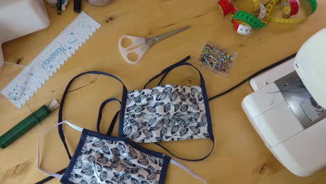 homemade face masks for protection with sewing utensils, rotating shot.