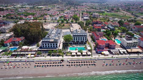 Drone-Overhead-of-Sundia-Exclusive-by-Liberty,-Hotel-on-Calis-Beach-in-Fethiye,-Turkey