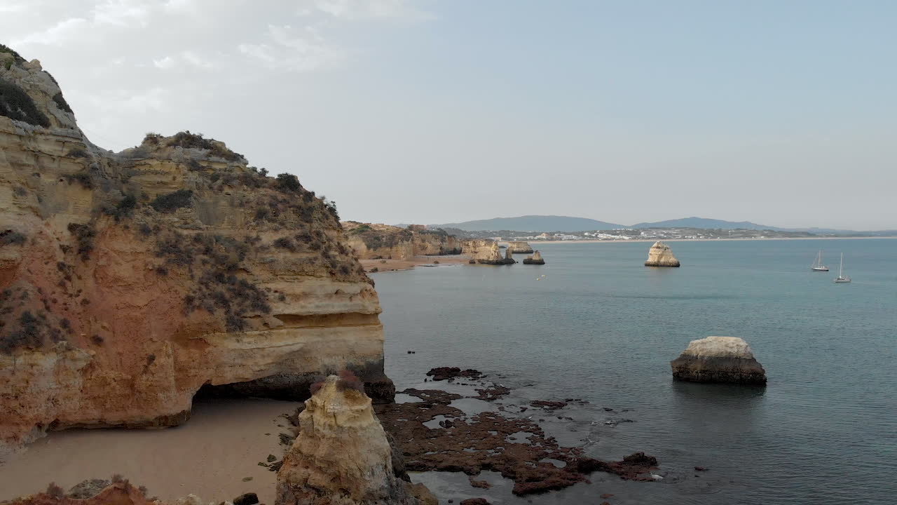 Aerial drone view of the deserted empty rocky beach and cliffs in Portugal