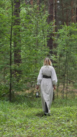 women in medieval walking in wood