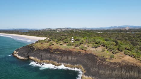 popular walking track along the fingal heads lighthouse headland with mount warning ex-volcano in the distance